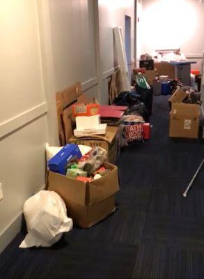 Overflowing trash room leaving garage littering the hallway (5th floor).