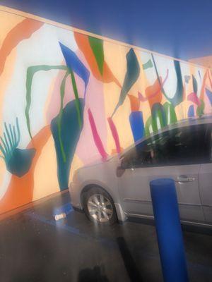 Mural next to parking lot.