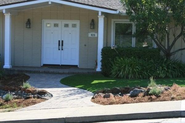 Curb appeal with curving walkway, new rounded porch and updated columns.