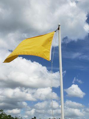 Yellow flag warned us of medium hazard conditions. It was windy and the current was strong.