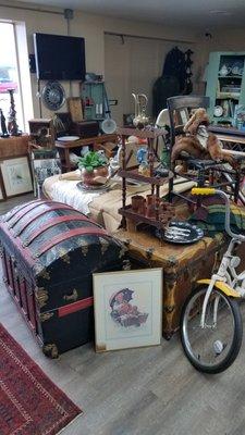 Antique trunks, bikes, pictures.