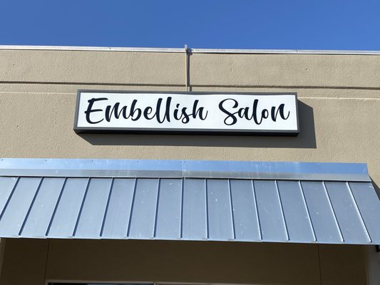 Name above salon entrance.