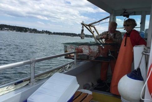 Captain Dennis and our Wyeth tour guide Rayette pulling up a lobster trap.