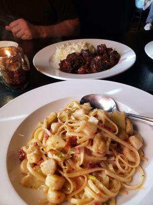 Linguine with sun dried tomatoes,bay scallops,in a buttery lemon sauce,and their famous chicken livers,and garlic smashed potatoes...