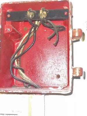 Fire boxes not hooked up or covered. Loose wiring everywhere, including near water.