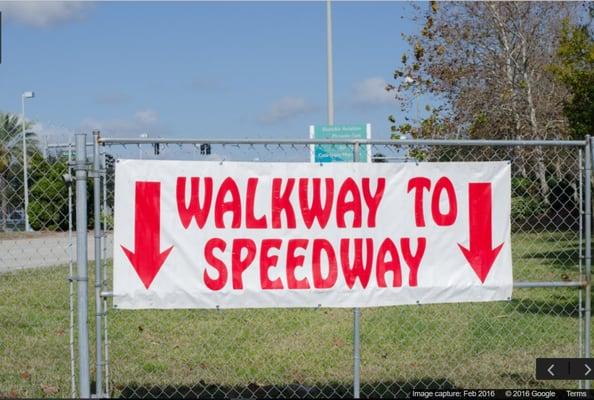 Private gated walkway that leads to the Speedway gets you to the entry gates in just a couple of minute's walk.