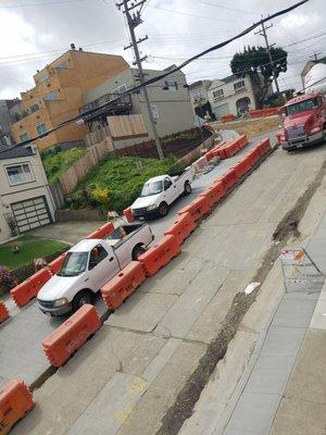 Parking on the road the day after pouring.  Residents can't park for months but they can't stay off the concrete for even a day.