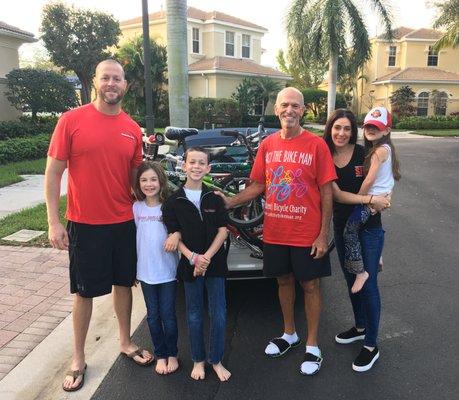 Managing Attorney of the Miami and Fort Lauderdale offices, Michael Feiner and family, donating bikes to local non-profit. #SIGCares