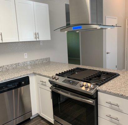 Remodeled kitchen with stainless steel appliances.