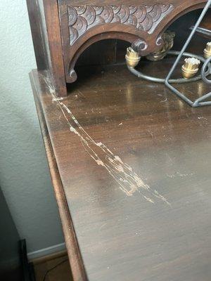 Damage to a beautiful antique dresser. Only one the of the several pieces damage without any compensation