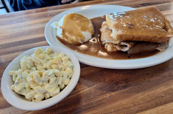 Roast beef and gravy, mashed potatoes, and macaroni salad.