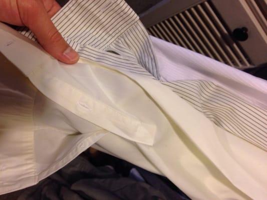 What the shirts that were dry cleaned here look like now (yellow) compared to one of my other white shirts. So frustrating.