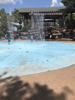 Children playing on splash pad.