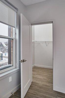 Spacious walk-in closet off the master bedroom in our 2-bedroom townhome.