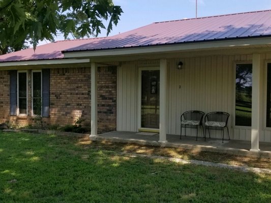 Metal roof, vinyl siding and windows