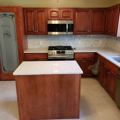 New countertops, flooring, backsplash and custom built pantry cabinet