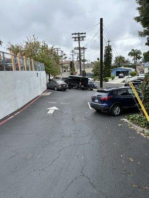 Driveway, with limited parking behind the building