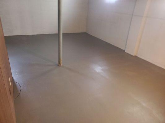 Chemically treated concrete floor, applied concrete dye and seal.