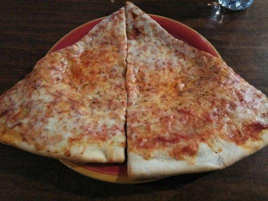 I haven't seen slices this big since I was in Jersey City NJ !! Look how they flop over the plate, thin crust, not super oily just right.