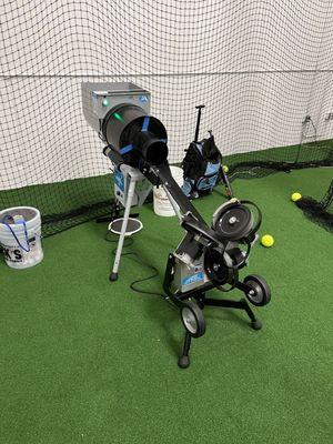 The softball pitching machine.