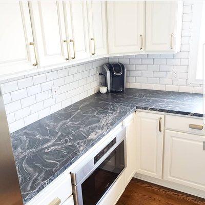 Modern farmhouse kitchen with leathered granite countertops