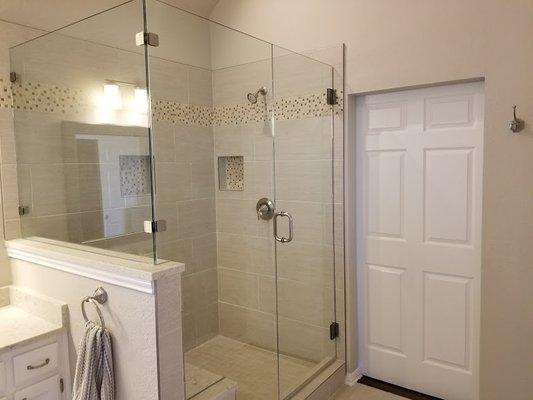 new master bath shower with floating seat, new tile and shower glass