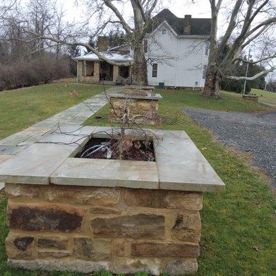 Used sandstone from old barn foundation to build these planters