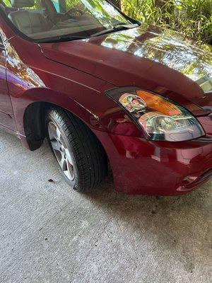 New headlights (R & L) replaced.  Pinstripe was touched up. (That is not a dent near the tire, it is a glare)