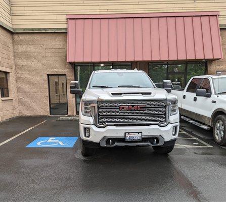 Owners truck with no consideration for the handicap that needed that spot. Told the guy to "bite it" when he asked him to move.