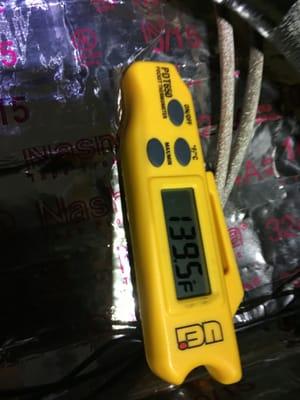 Houston measuring the temperature of the air inside my new air handler. Heating temps within range.