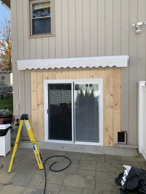 Converted garage door into a sliding glass door