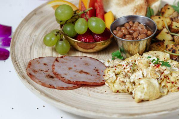 Scrambled Eggs, Canadian ham, fruit, and beans