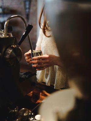 Barista making a latte