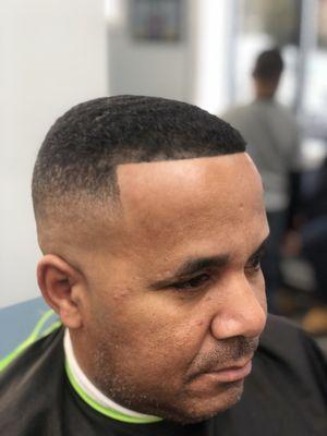 Traditional high and tight fade.