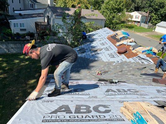 Installing starter shingles along Eves.