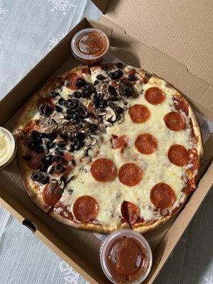 Thin crust pizza w/ pepperoni on whole pie & 1/2 mushroom/black olive. Complimentary sides of red sauce and garlic butter.