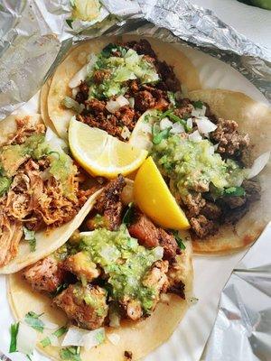 Carnitas, chicken, carne asada, and el pastor tacos. Hubby and I shared. I just pick at all the toppings.