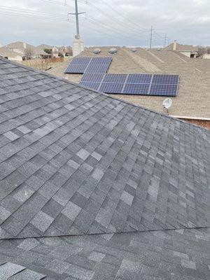 My roof compared to the neighbors. The color really stands out.