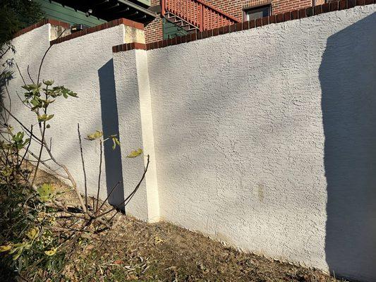 The old stucco had cross-hatched etches made into the wall instead of lath. N&J Alvarez redid the wall properly with lath.