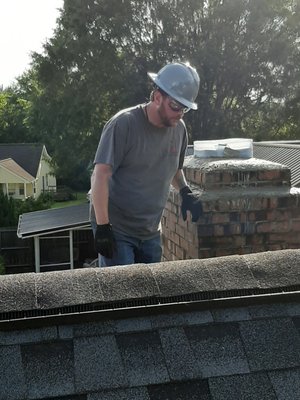 Repairing a bad chimney crown.