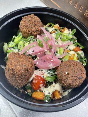 Vegan Falafel Bowl- Sautéed Kale Slaw-Quinoa-Blistered Tomatoes-Sweet Potatoes-Ginger Miso Tahini Dressing