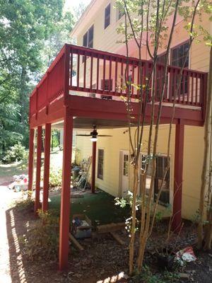 Underdeck gutter system with outdoor fan installed. Stained SHERWIN WILLIAMS SUPERDECK solid color stain.