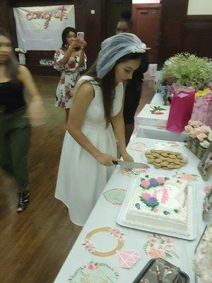 Bride to be cuts her cake