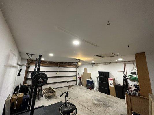 2-4 foot fluorescent lights removed and 6 recessed lights added to garage.