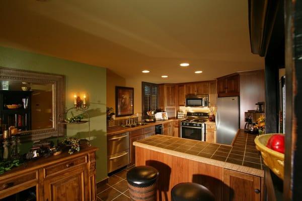 An Indianapolis crawlspace converted to wine grotto kitchenette