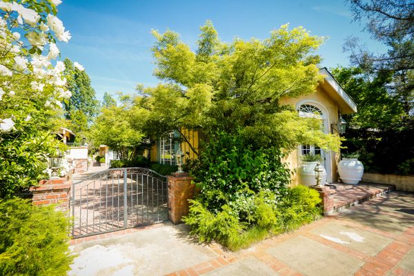 The house is a four bedroom mansion (with an additional two bedrooms in an adjacent building)... pool, fire pit, gourmet kitchen...