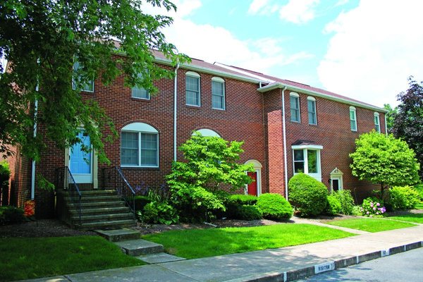 Entryway of our Fairfax Village Townhomes featuring beautiful brick detail.