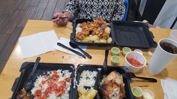 Camarrones Al Grill with fried yucca and roasted potatoes, and quarter chicken white with fried yucca and white rice, plus pico