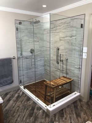 Fully remodeled bathroom that removed enclosed fiberglass shower and installed a customized glass walk in shower experience.