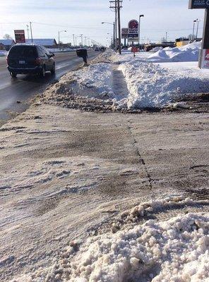 Emergency trails cut down S. Centerville road after sidewalks became buried in thick snow and ice from interstate plow trucks.